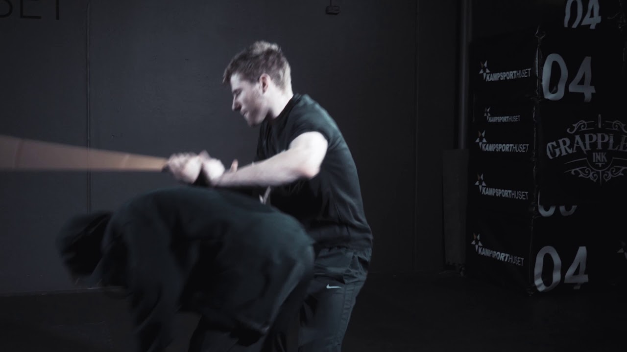 An athlete training strength with a resistance band.